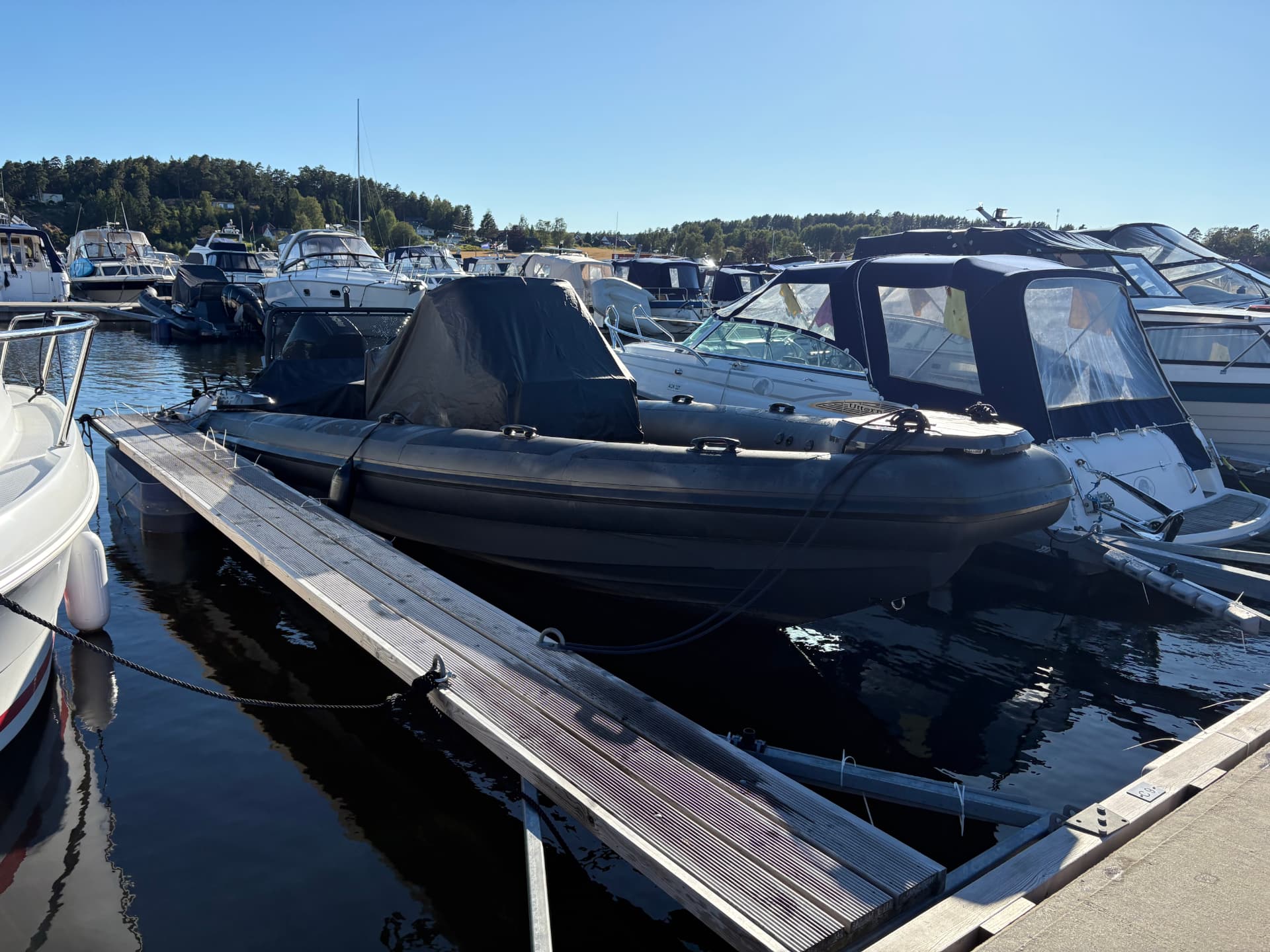 The private RIB at its berth near the villa