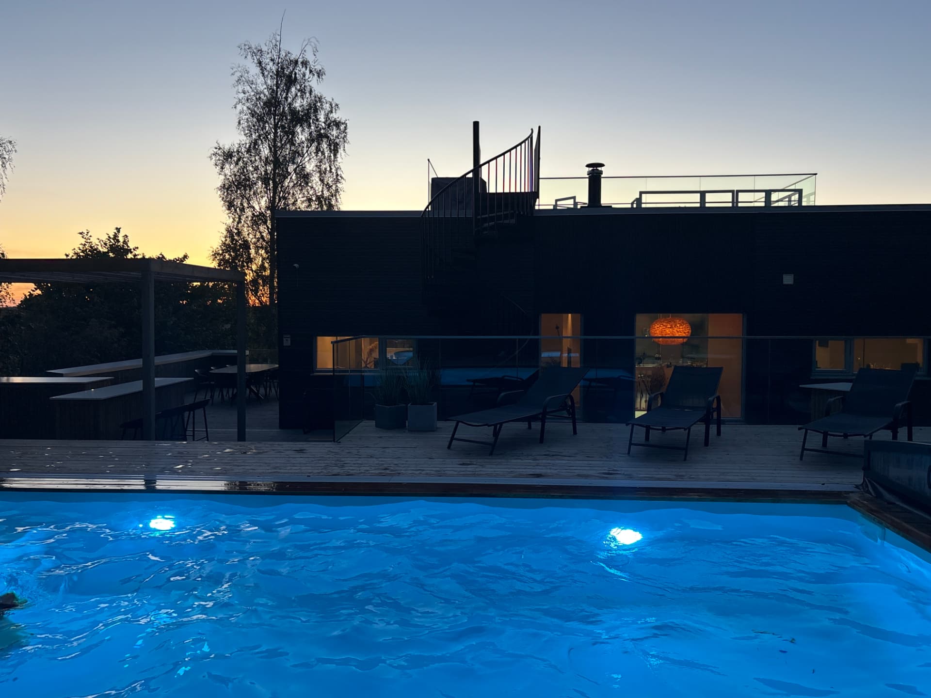 The villa and pool at dusk